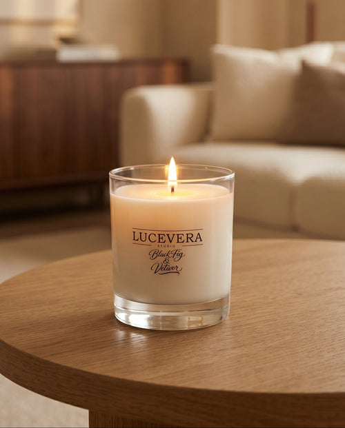 Lucevera candle on a wooden table in a cozy living room setting