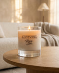 Lucevera candle on a wooden table with a blurred background